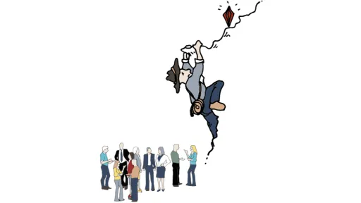 Kiipeilijä tavoittelee kallion reunalla tasapainottelevaa timanttia. 