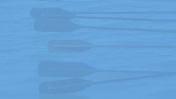 Soutuveneen airot vesillä sinisen suodattimen alla.