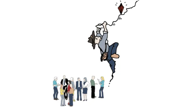 Kiipeilijä tavoittelee kallion reunalla tasapainottelevaa timanttia. 